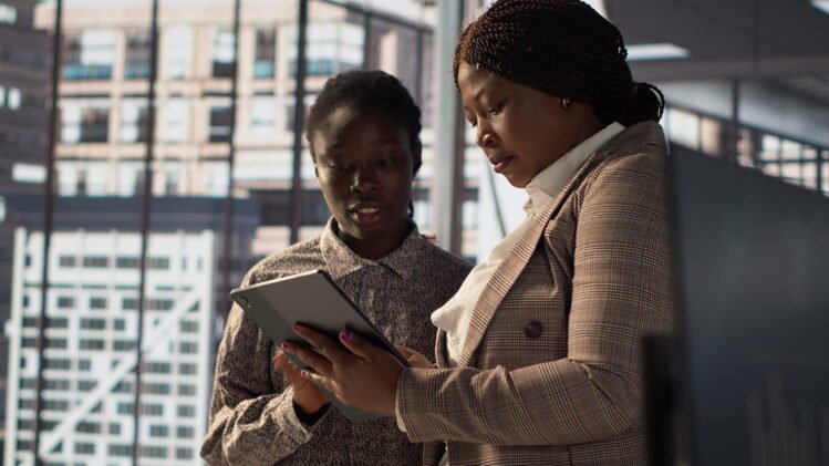 business-associates-reviewing-objectives-data-performance-metrics(1)